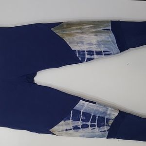 Blue and tie dye workout leggings with sheer material at ankles